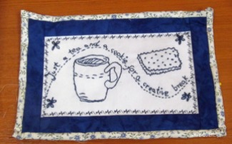 Blue and white quilted mug rug